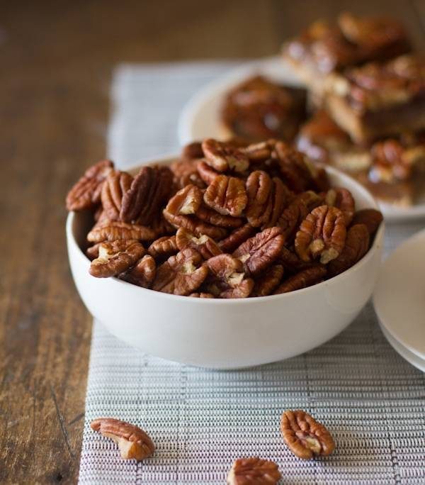 Pecans in a white bowl.
