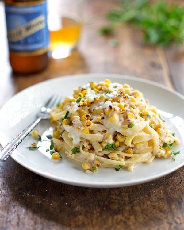 Chipotle sweet corn fettuccine on a white plate.