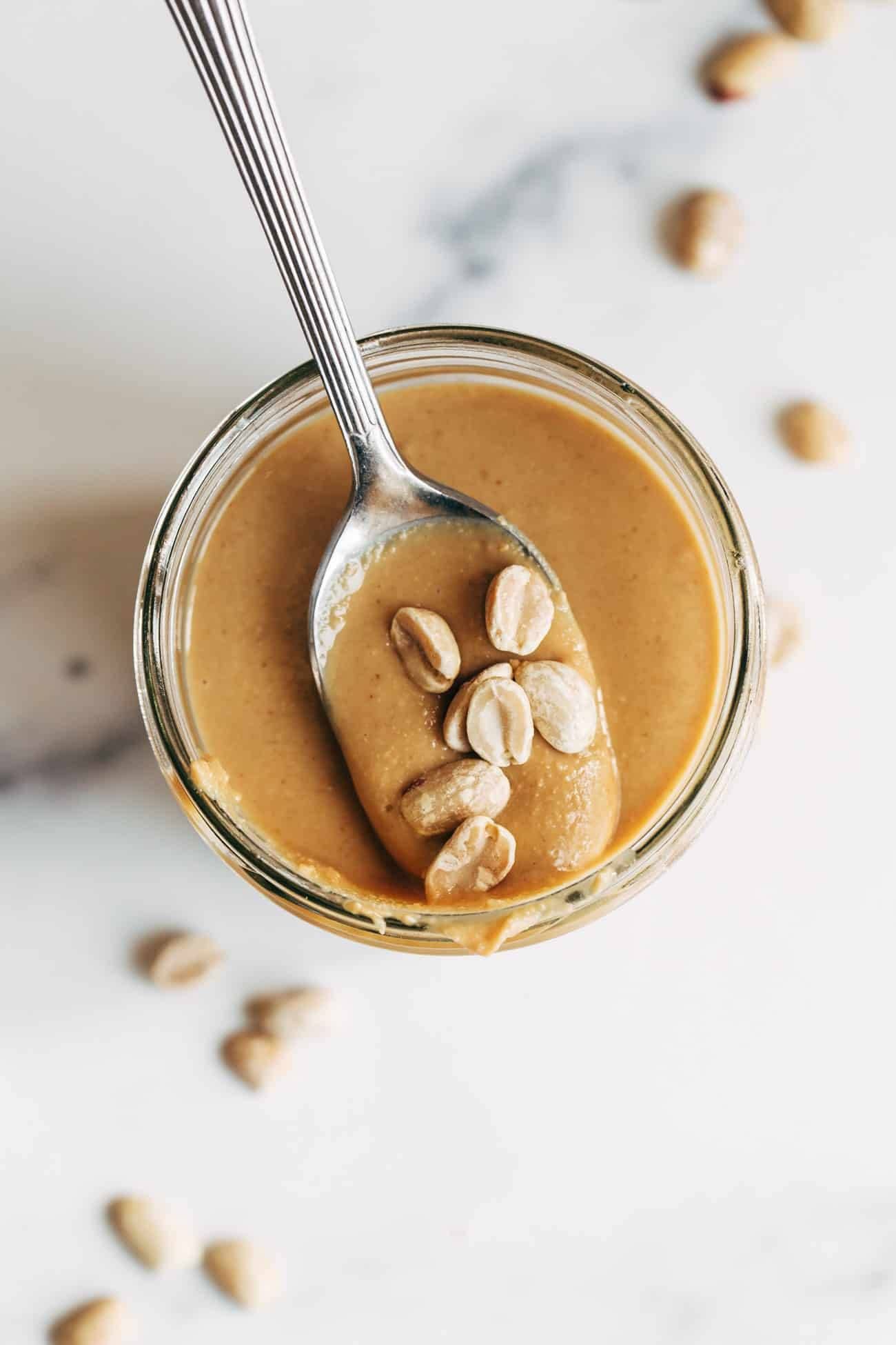 Scoop of homemade peanut butter on a spoon