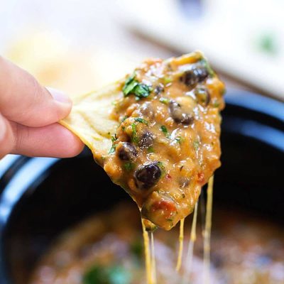 Homemade Cheesy Chili Dip on a chip.