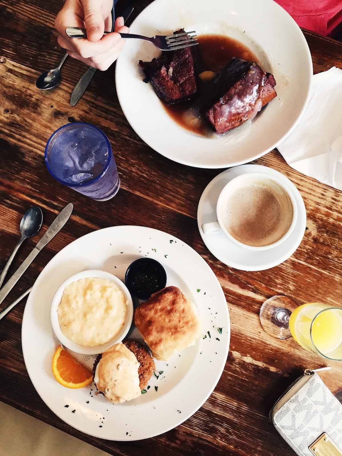 Table with plates of food.