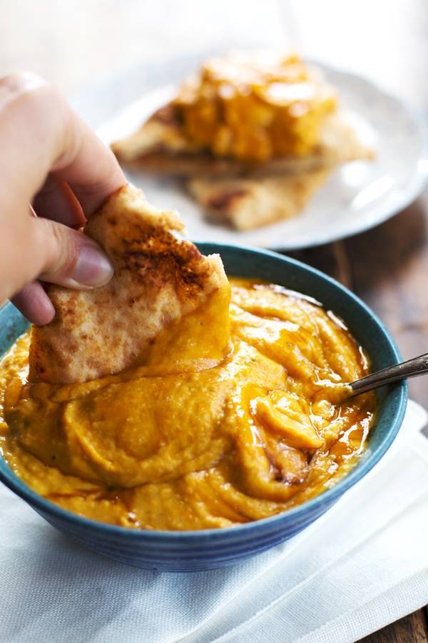 Roasted Garlic and Rosemary Pumpkin Hummus. 100 calories and totally addicting. From Pinch of Yum.