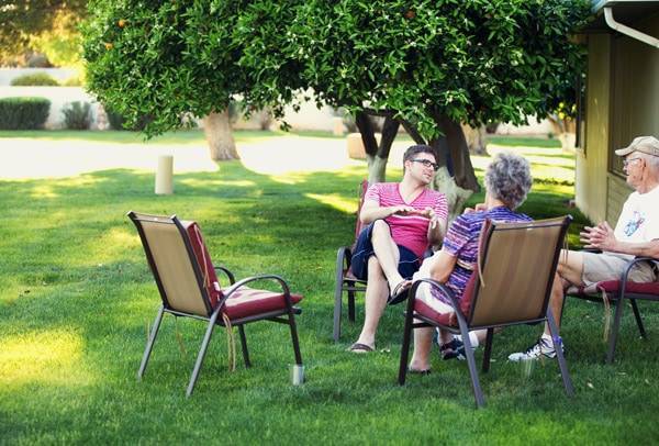People sitting out on chairs.