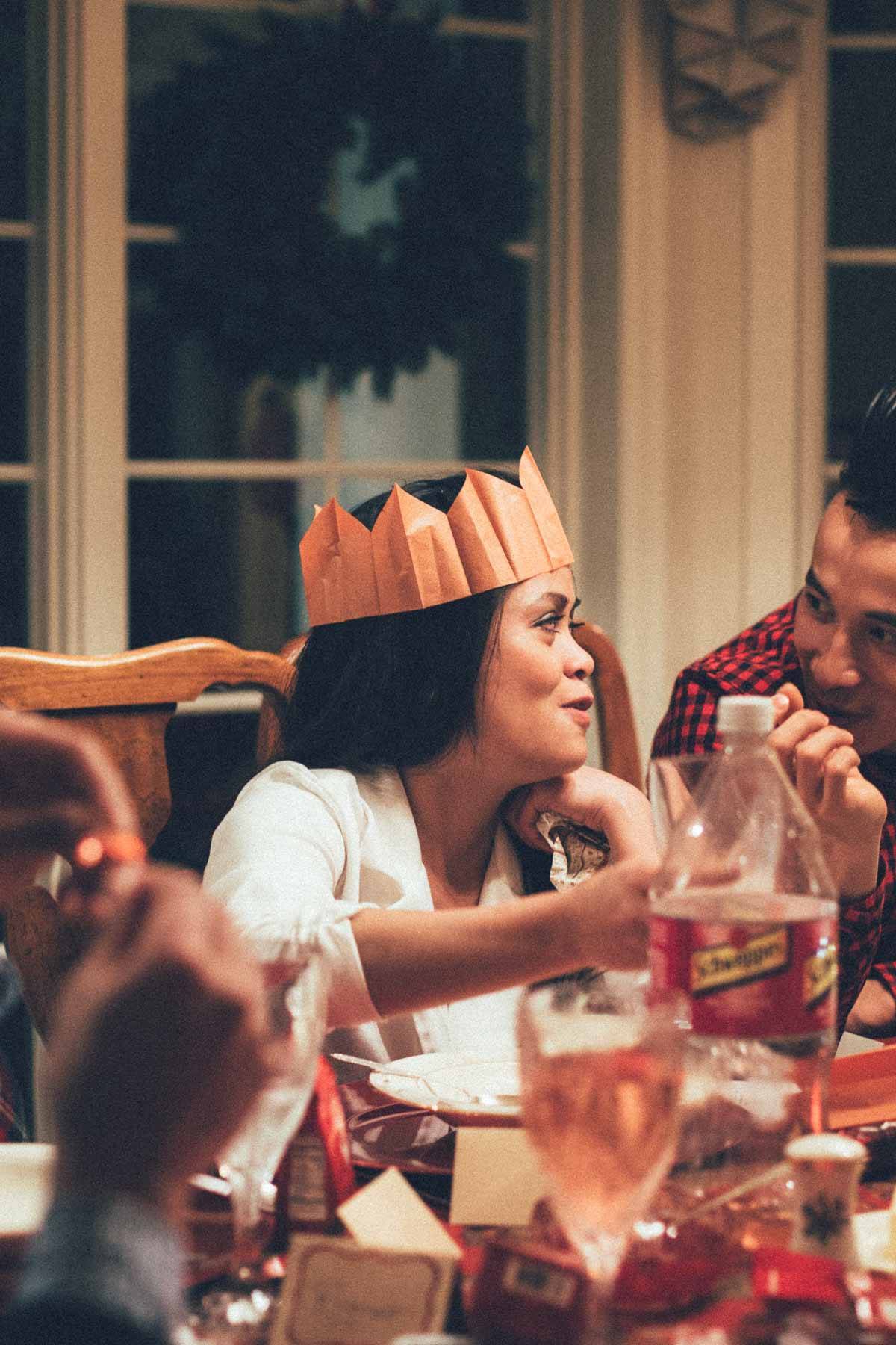 Girl wearing a paper crown.