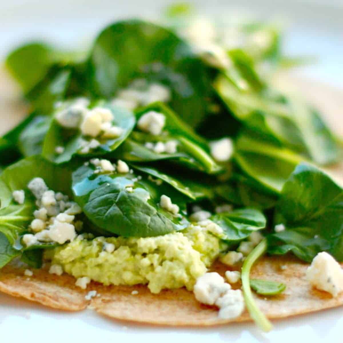 Unwrapped whole wheat vegetarian wrap with edamame hummus.